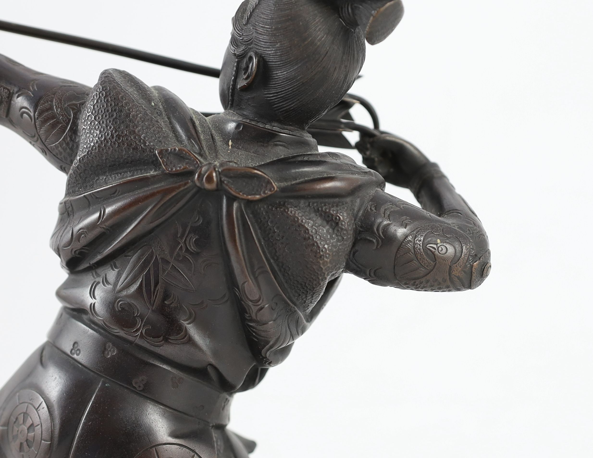 A Japanese bronze figure of a kneeling archer, Meiji period, 40 cm high